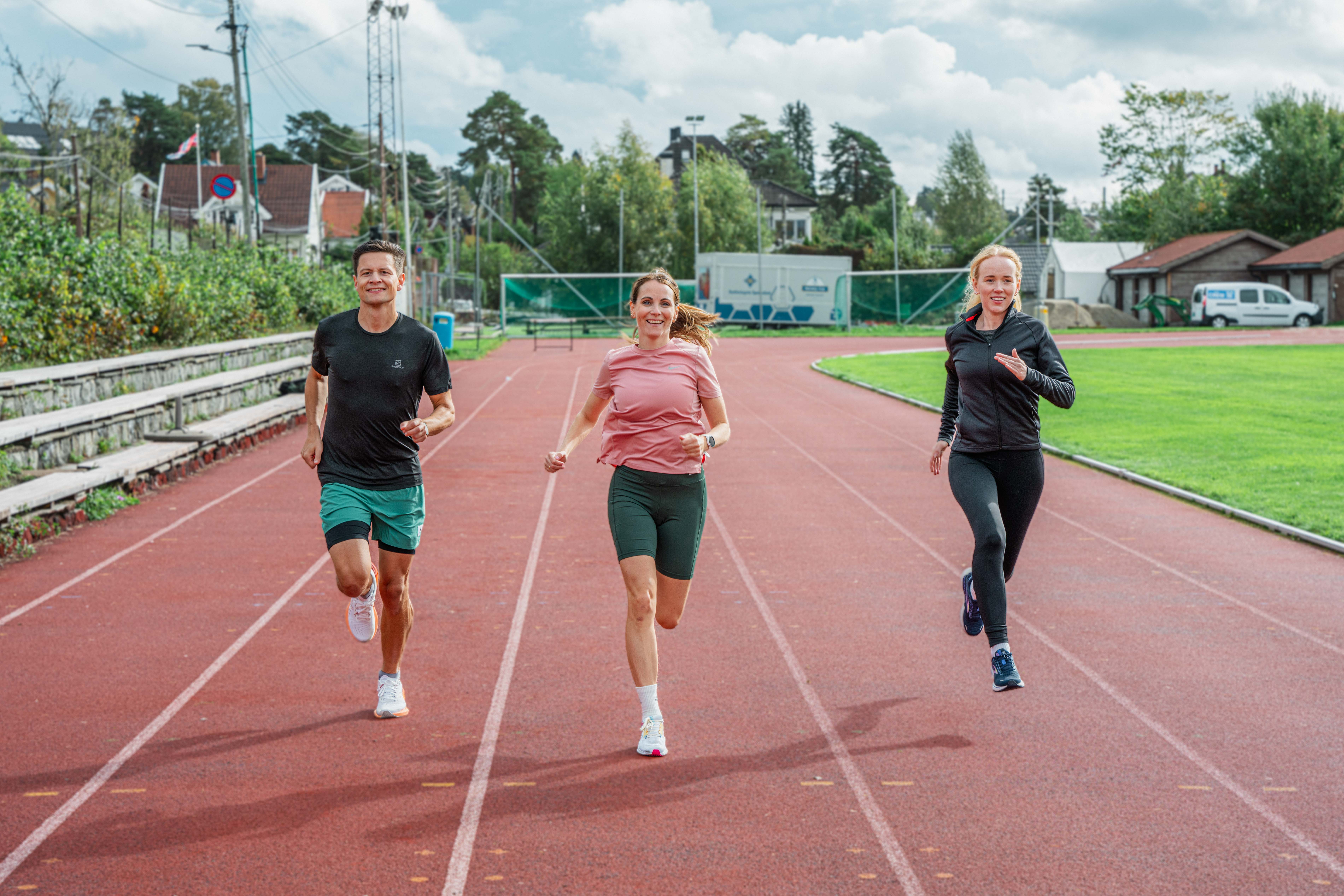Three people jogging outdoors